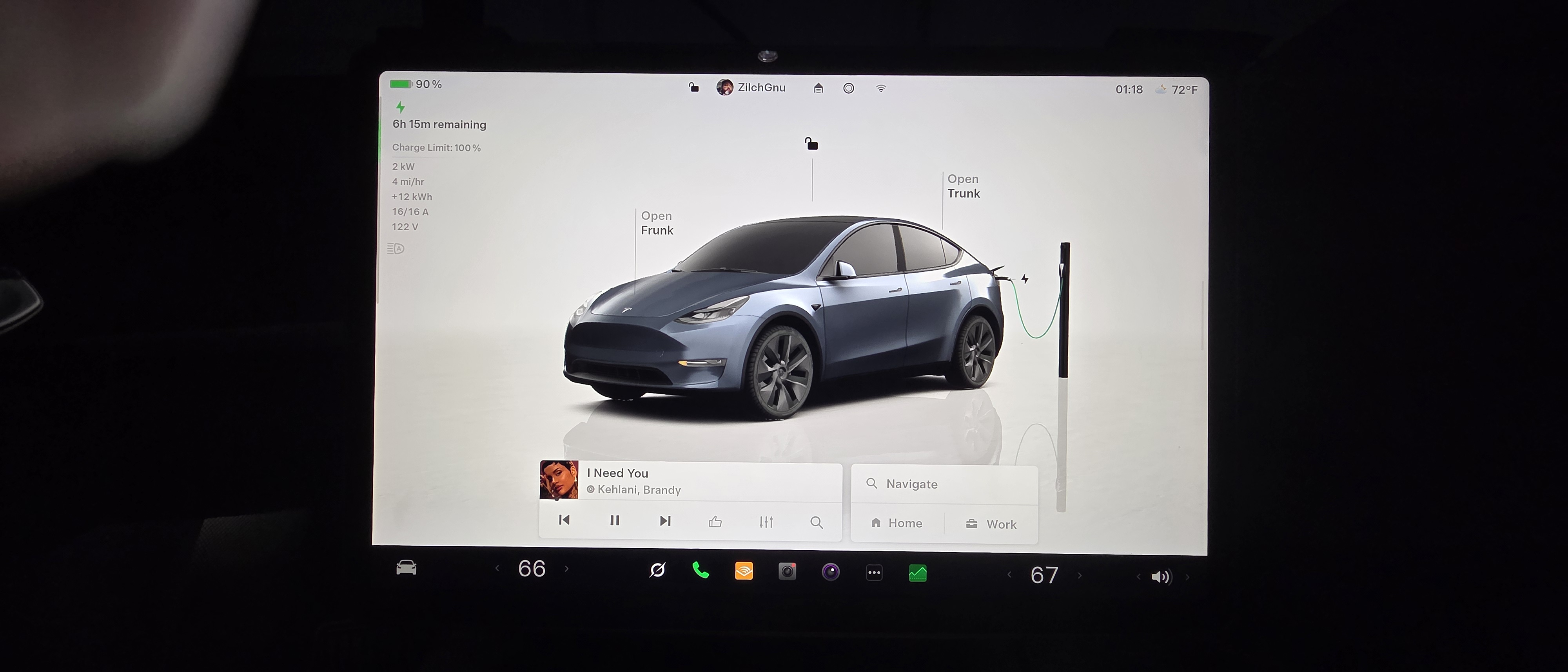 Tesla screen showing charging status.