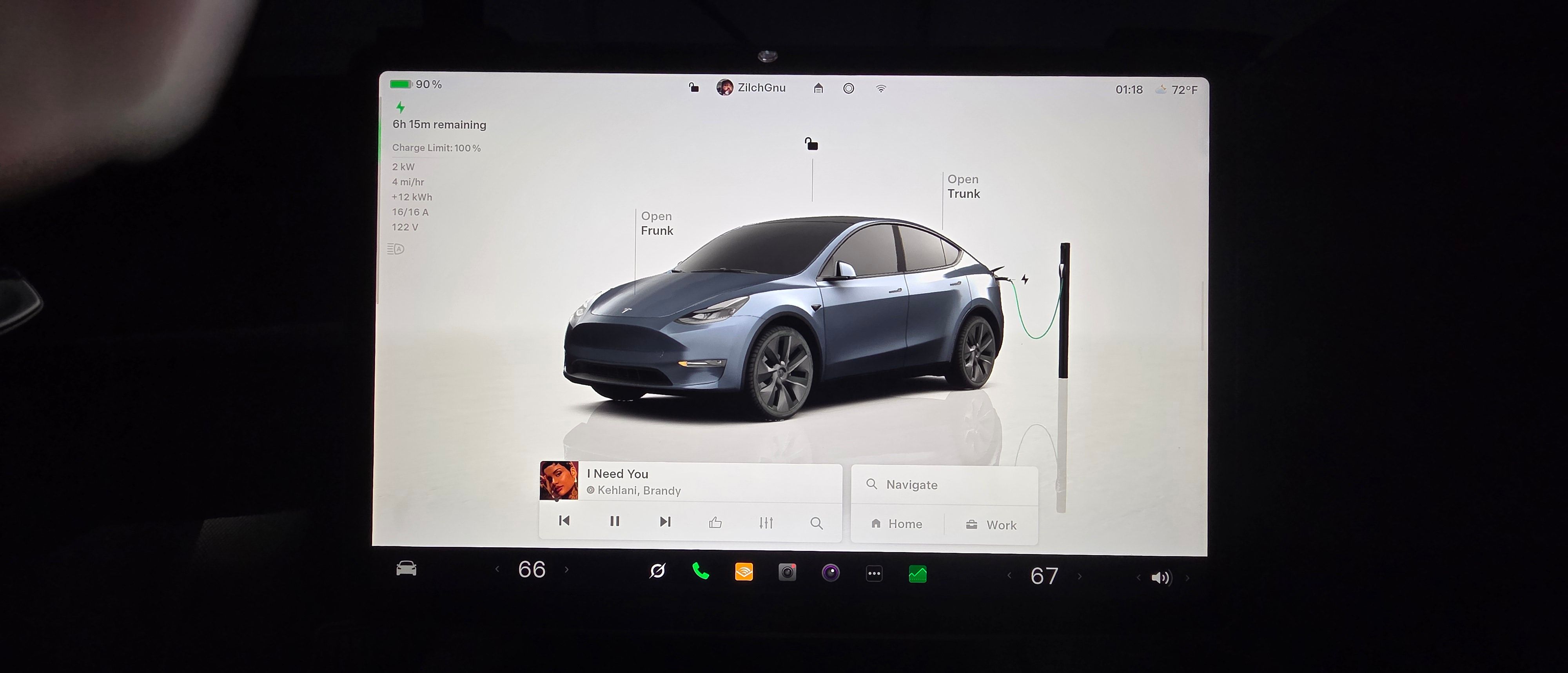 Tesla screen showing charging status.