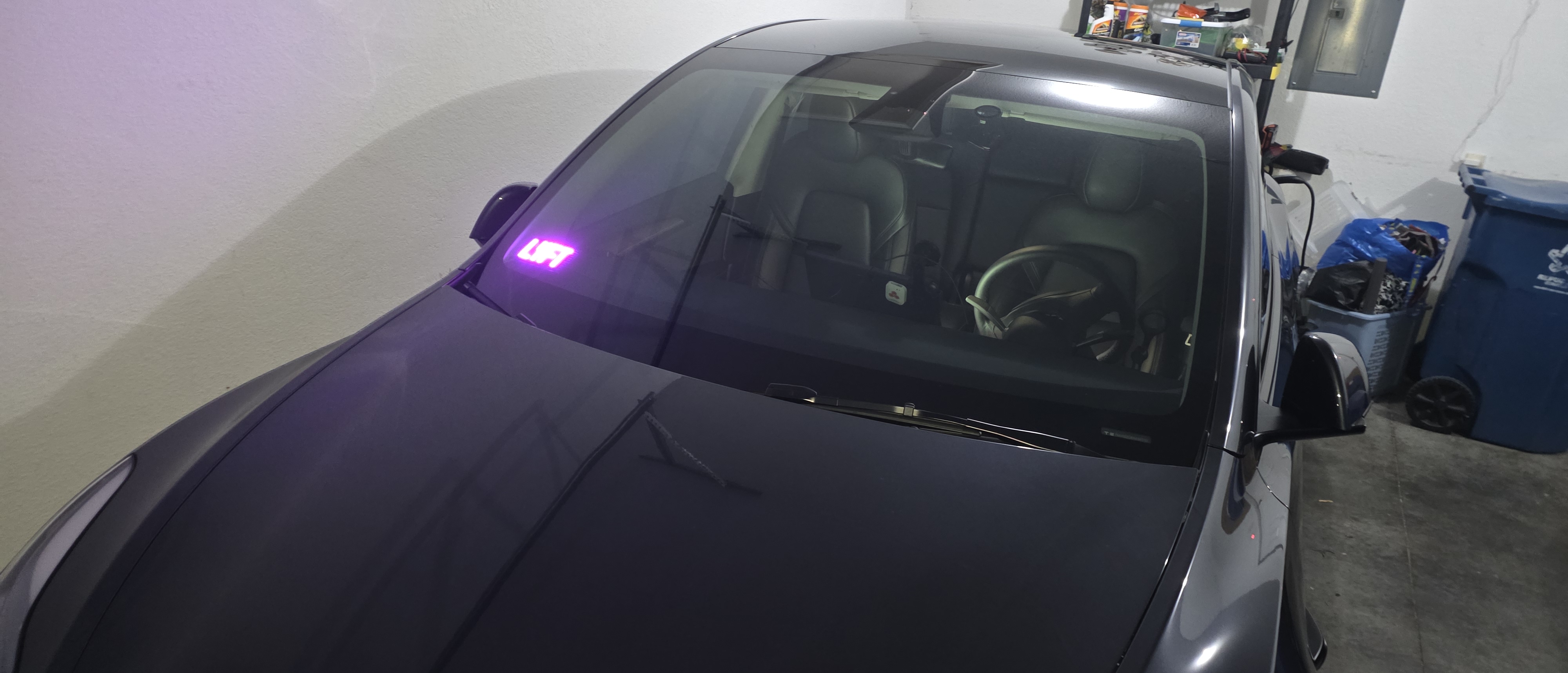 Lyft sticker on the sun visor.